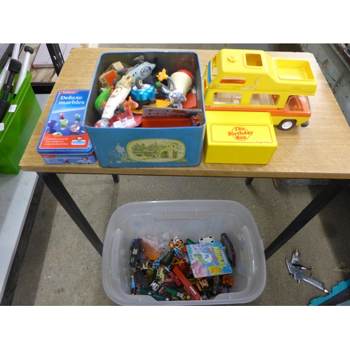 2083 - A box of toys inc. deluxe marbles, hot rod racer Lego, and toy cars