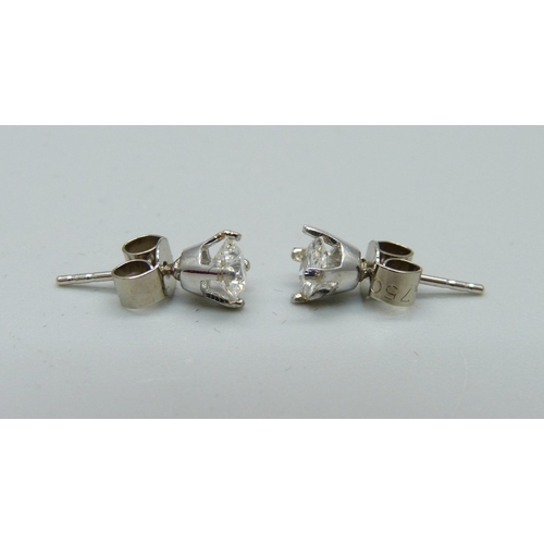 1014 - A pair of 18ct white gold and diamond earrings, approximately 0.50ct total diamond weight