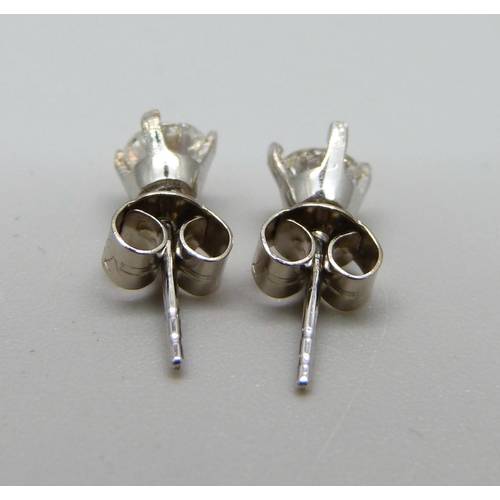 1014 - A pair of 18ct white gold and diamond earrings, approximately 0.50ct total diamond weight