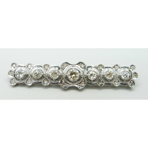 1025 - A white metal and diamond set brooch, centre stone approximately 0.5ct, six other diamonds approxima... 