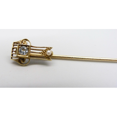 1026 - A 14ct gold, topaz and pearl stick pin, 1.6g