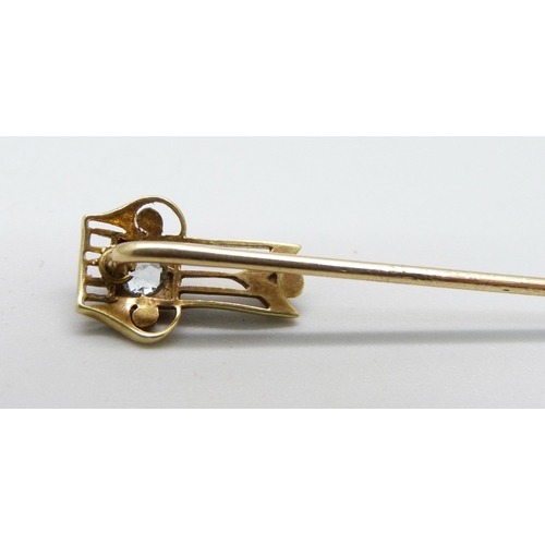 1026 - A 14ct gold, topaz and pearl stick pin, 1.6g