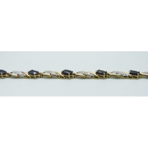 1033 - A 9ct gold sapphire and diamond bracelet, 7.5g, 19cm