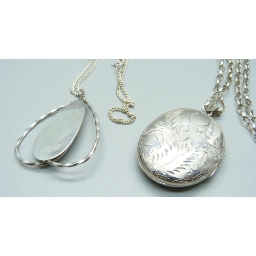 1040 - A silver Arts and Crafts pendant and chain and a silver locket and chain