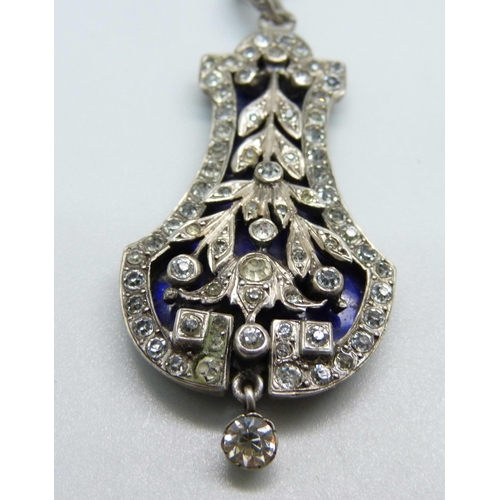 1041 - A silver paste and enamel pendant and chain, and a silver paste double clip brooch