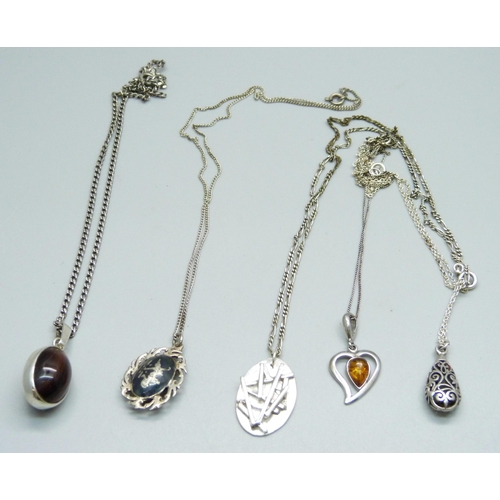 1042 - Five silver pendants and chains