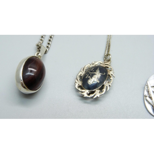 1042 - Five silver pendants and chains