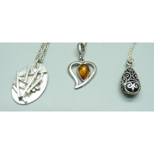 1042 - Five silver pendants and chains