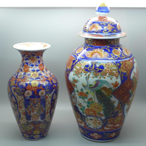 606 - A Japanese porcelain Imari vase, 22cm and an Imari vase and cover, tallest 32cm