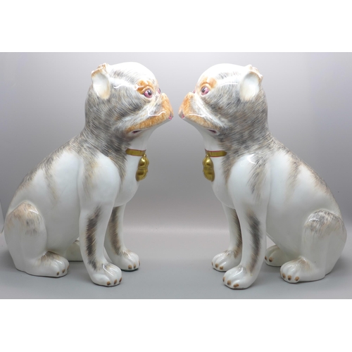 610 - A pair of Sutherland porcelain dogs, 24cm
