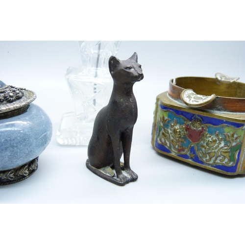 635 - A scent bottle in the form of a pagoda, an ashtray, a lidded pot and a cat figure