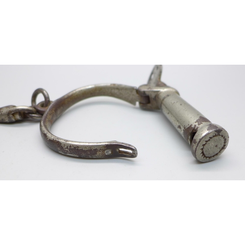 636 - A pair of mid 20th Century handcuffs with key
