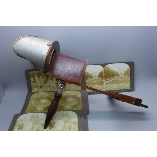 650 - A stereoscope, circa 1897 and a collection of stereoscope slides