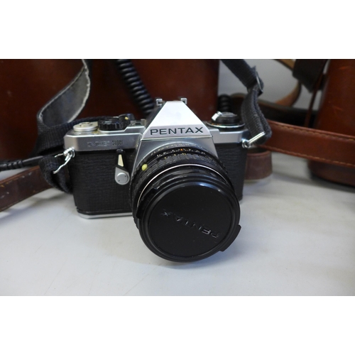 652 - A Minolta SR3 35mm film camera and a Pentax ME Super 35mm film camera with additional lenses, both c... 