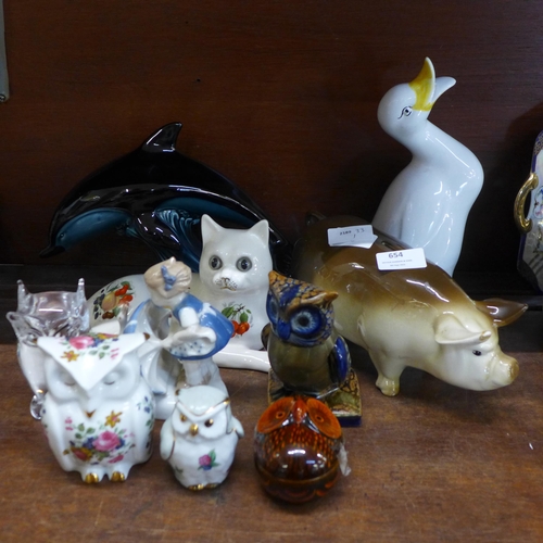 654 - A collection of animal and owl figures including a clear glass owl paperweight signed G. Ruocco, pig... 