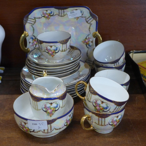 655 - A Bavaria lustre six setting tea set with bread and butter plate, sugar and cream jug, one cup a/f
