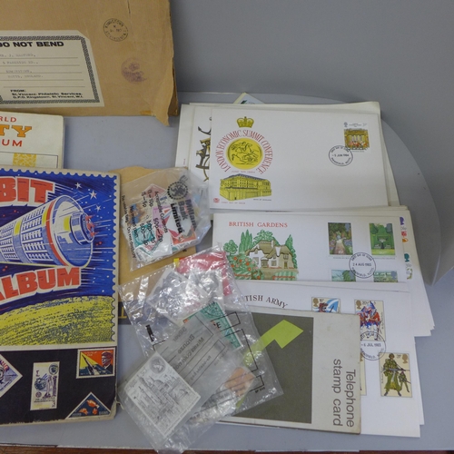 657 - A collection of stamps in albums and loose, some 1980s stamp first day covers, also with one volume ... 
