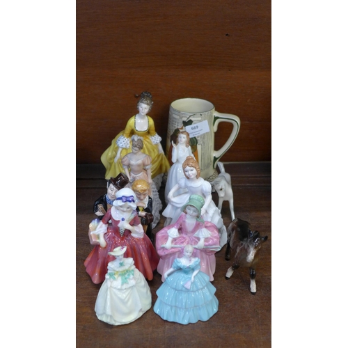 669 - A collection of figures, mainly Royal Doulton including two Dickens characters and also a Royal Doul... 