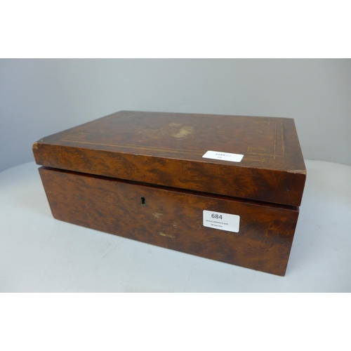 684 - A wooden box containing costume jewellery