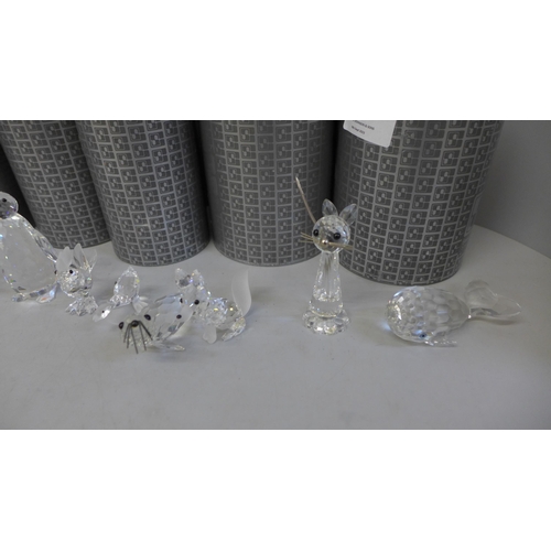 685 - A collection of twelve Swarovski crystal animals including tortoise, mouse, seal, penguin, fox and f... 