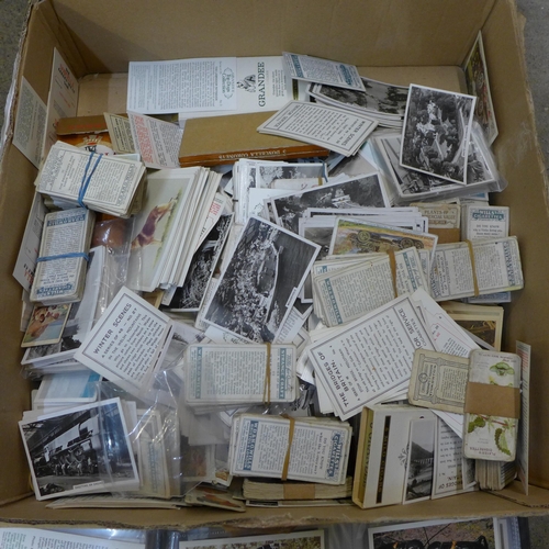 717 - Cigarette cards; a box of cigarette and trade cards