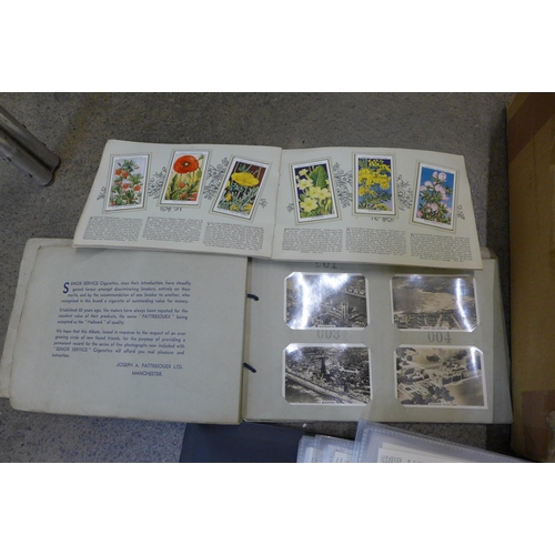 717 - Cigarette cards; a box of cigarette and trade cards