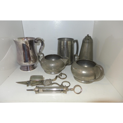 722 - A plated Garrard mug, a pewter mug with Lockheed Martin related inscription, three items of hammered... 