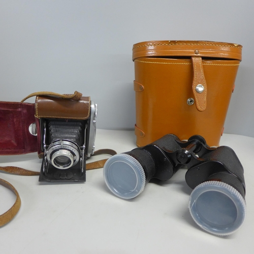 747 - A pair of Boots 10 x 50 binoculars and a camera