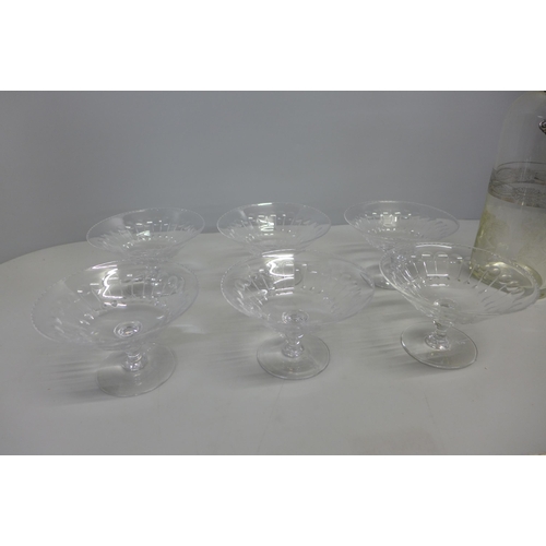 765 - A set of six early-20th Century coupe dishes with cut glass bowls and a whisky/spirit decanter with ... 