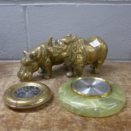 776 - A brass model hippopotamus and a rhinoceros, a barometer and a compass