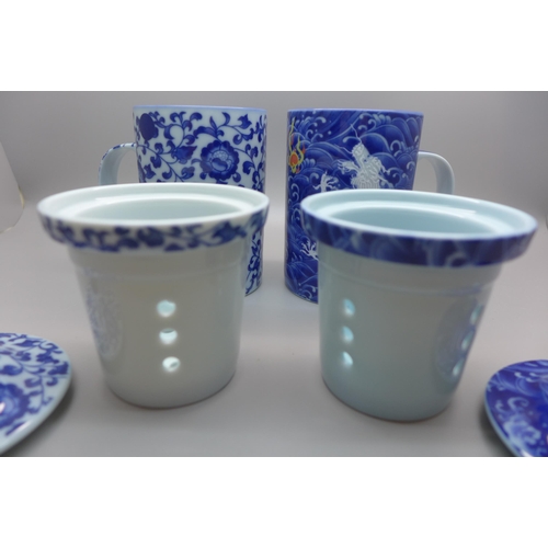 778 - Two oriental blue and white tea infusers