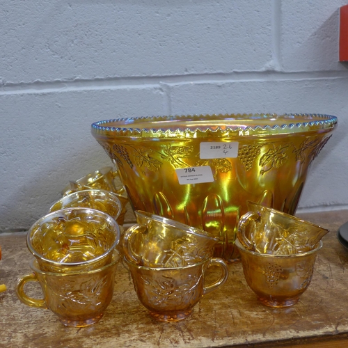 784 - A carnival glass punch bowl and twelve cups