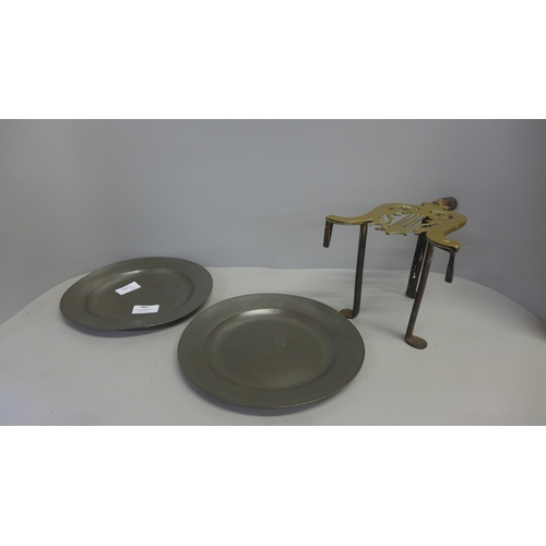 785 - Two 18th Century pewter plates and a trivet