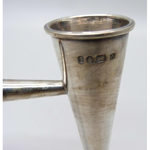 822 - A silver candle snuffer, London 1979, 25cm