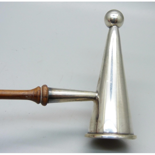 822 - A silver candle snuffer, London 1979, 25cm