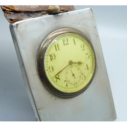 823 - A silver mounted travel clock, Birmingham 1910