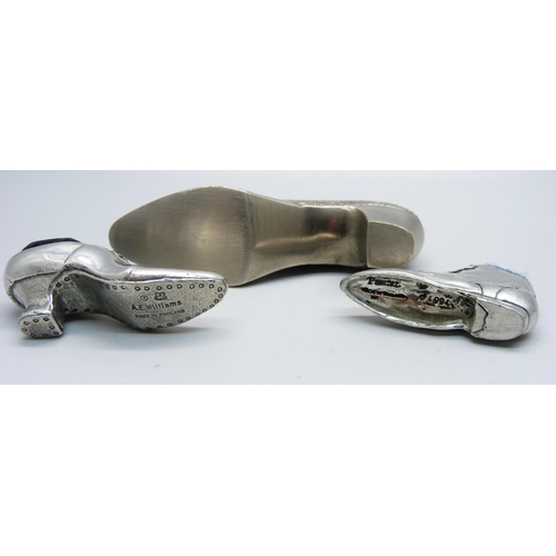 829 - Three novelty pewter pin cushion shoes