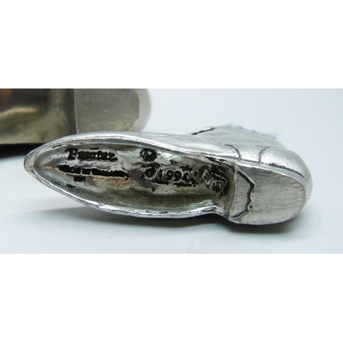 829 - Three novelty pewter pin cushion shoes