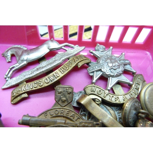 838 - Militaria; cloth badges, handkerchief, metal soldiers, uniform buttons, badges, leather pouch, etc.