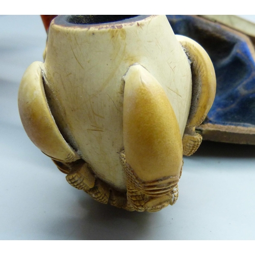 850 - A large carved Meerschaum pipe in the form of a claw, cased