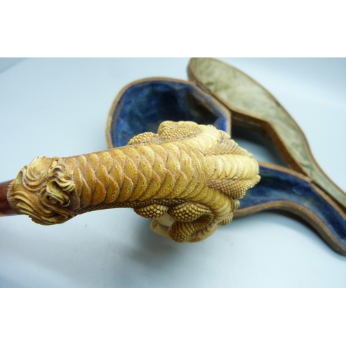 850 - A large carved Meerschaum pipe in the form of a claw, cased