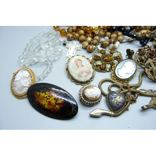 872 - A collection of brooches, hat pins, necklaces, crucifix, etc.