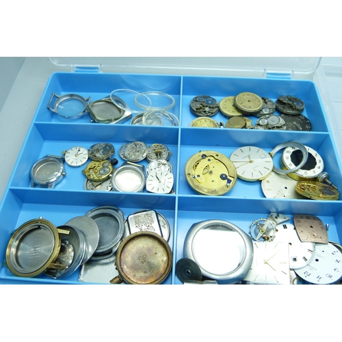 878 - A collection of watch movements and dials including Omega