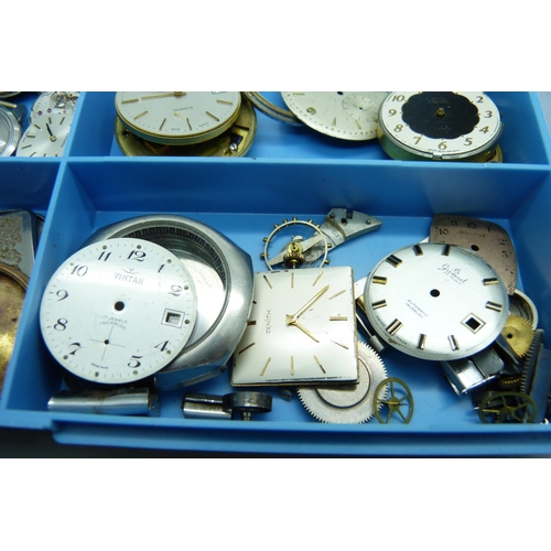 878 - A collection of watch movements and dials including Omega