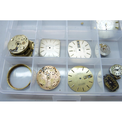 878 - A collection of watch movements and dials including Omega