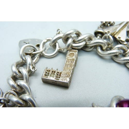 904 - A silver charm bracelet, 97g