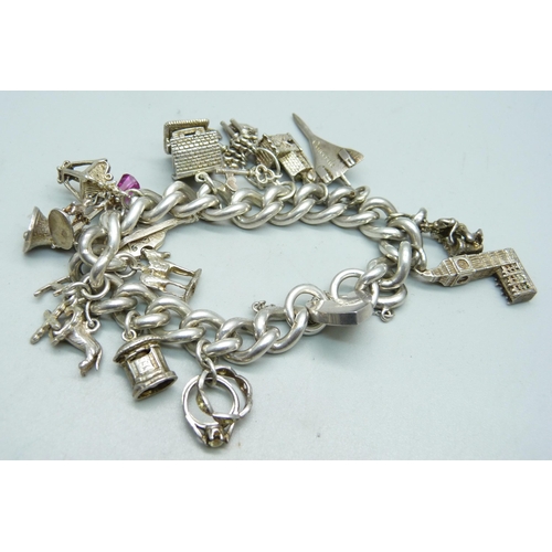 904 - A silver charm bracelet, 97g