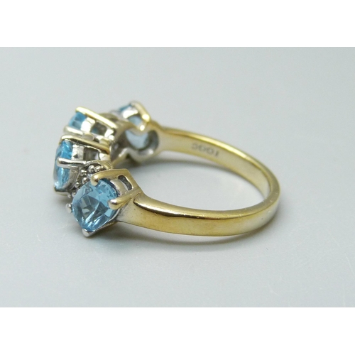 910 - A silver gilt, aquamarine and zircon ring, L/M