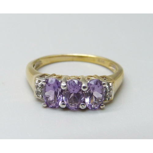 918 - A silver gilt, amethyst and zircon ring, O