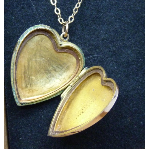 927 - An engraved 9ct gold locket and chain, Birmingham 1906, 4.5g